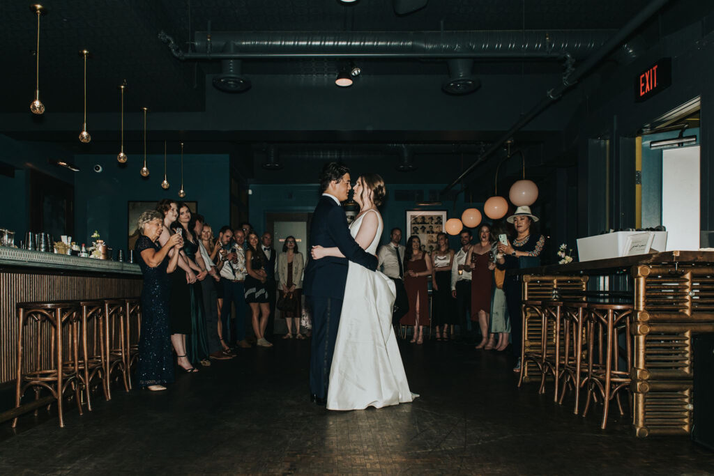 Wedding couple enjoying their first dance in the Offcut Bar at The Nash Restaurant in Calgary